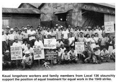Kauaʻi longshore workers and family members holding strike signs in 1949